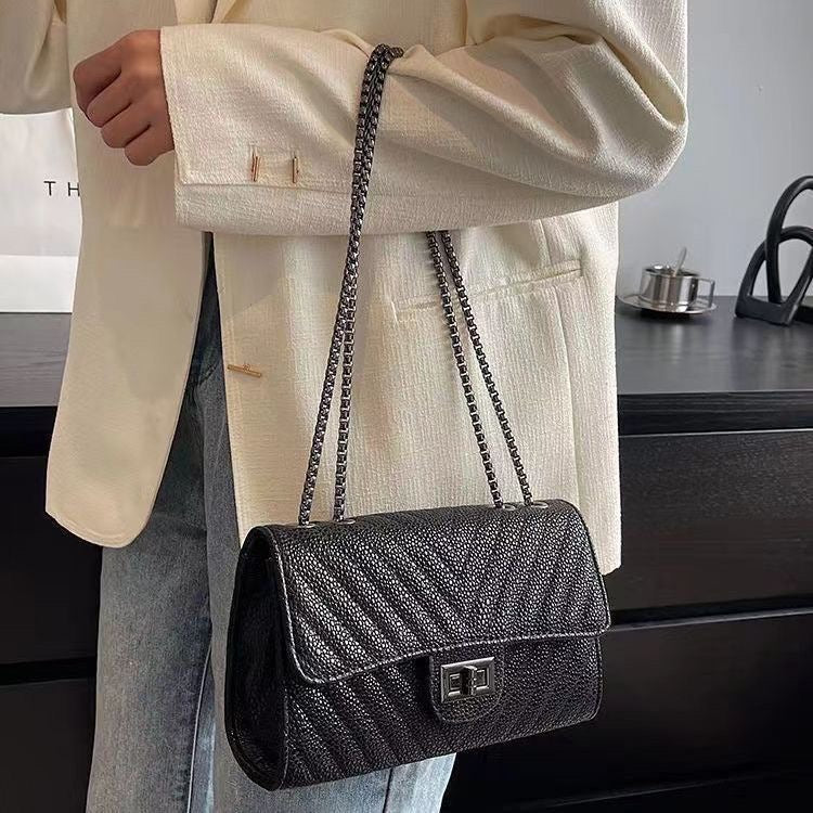 Obsidian Textured Chain Flap Bag